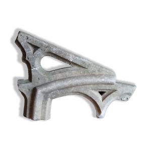 Ancient Romanesque fragment of a marble mullioned window with tracery. Medieval period.
